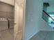 Convenient laundry room with washer, dryer, and overhead shelving at 14154 Dove Hollow Dr, Orlando, FL 32824