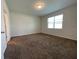 Spacious bedroom with brown carpet and large window at 14154 Dove Hollow Dr, Orlando, FL 32824