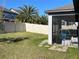 Backyard view showing screened patio, grassy area, and privacy fence at 14154 Dove Hollow Dr, Orlando, FL 32824