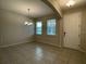 Bright dining room with tile floors and access to the kitchen at 14154 Dove Hollow Dr, Orlando, FL 32824