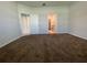 Primary bedroom with carpet and ensuite bathroom access at 14154 Dove Hollow Dr, Orlando, FL 32824