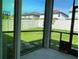 Bright screened patio overlooking the backyard with a view of the homes at 14154 Dove Hollow Dr, Orlando, FL 32824
