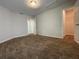 Bedroom with carpet, walk-in closet, and ensuite access at 14154 Dove Hollow Dr, Orlando, FL 32824