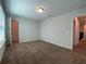 Spacious bedroom with carpet and access to hallway at 14154 Dove Hollow Dr, Orlando, FL 32824