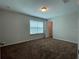 Bright bedroom featuring a walk-in closet and window at 14154 Dove Hollow Dr, Orlando, FL 32824
