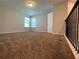 Spacious loft area with carpet and two windows at 14154 Dove Hollow Dr, Orlando, FL 32824