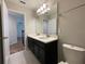 Double vanity bathroom with a toilet and view of stairs at 14154 Dove Hollow Dr, Orlando, FL 32824