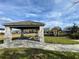 Community pavilion with picnic tables and playground at 14154 Dove Hollow Dr, Orlando, FL 32824