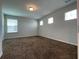 Spacious bedroom with plush carpet and large window at 14154 Dove Hollow Dr, Orlando, FL 32824