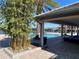 Community pool with lounge chairs and covered seating at 14154 Dove Hollow Dr, Orlando, FL 32824