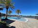 Resort-style pool with palm trees and a play area at 14154 Dove Hollow Dr, Orlando, FL 32824