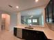 Kitchen with a view into the living room and staircase at 14154 Dove Hollow Dr, Orlando, FL 32824