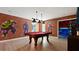 Game room with pool table and Marvel character murals at 2726 Oxymoron Way, Kissimmee, FL 34746