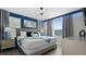 Spacious bedroom with king bed and blue accents at 2726 Oxymoron Way, Kissimmee, FL 34746