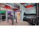 Game room with foosball table, bunk beds, and Marvel theme at 2726 Oxymoron Way, Kissimmee, FL 34746