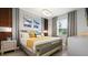 Elegant bedroom with king-size bed and accent wall at 2726 Oxymoron Way, Kissimmee, FL 34746