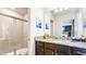 Bathroom boasts granite vanity, shower, and modern fixtures at 3020 Mahalo Dr, Davenport, FL 33897