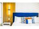 Stylish bedroom with a king-size bed, wood and brick wall detail at 3020 Mahalo Dr, Davenport, FL 33897