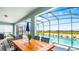 Relaxing pool area with patio furniture and screened enclosure at 3020 Mahalo Dr, Davenport, FL 33897