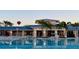 Resort-style pool with a clubhouse and lounge chairs at 3020 Mahalo Dr, Davenport, FL 33897