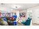 Fun game room with a sectional sofa and superhero theme at 3020 Mahalo Dr, Davenport, FL 33897