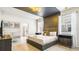 Bright main bedroom with a king-size bed and ensuite bathroom access at 3020 Mahalo Dr, Davenport, FL 33897