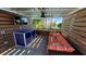 Relaxing outdoor lounge area with a TV and comfortable seating at 3020 Mahalo Dr, Davenport, FL 33897
