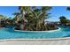 Enjoyable lazy river winding through landscaping at 3020 Mahalo Dr, Davenport, FL 33897