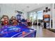 Fun game room with air hockey and arcade games at 3020 Mahalo Dr, Davenport, FL 33897