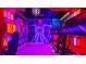 Themed bedroom with bunk beds and vibrant lighting at 3020 Mahalo Dr, Davenport, FL 33897
