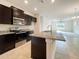 Modern kitchen featuring granite countertops and stainless steel appliances at 3654 Sagefield Dr, St Cloud, FL 34773