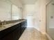 Elegant bathroom with double vanity and granite countertops at 3654 Sagefield Dr, St Cloud, FL 34773