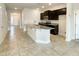 Kitchen with dark cabinetry, granite countertops, and an island at 3654 Sagefield Dr, St Cloud, FL 34773