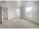 Spacious bedroom with carpeted floors and large window at 3654 Sagefield Dr, St Cloud, FL 34773