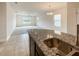 Kitchen with granite island and stainless steel sink at 3654 Sagefield Dr, St Cloud, FL 34773