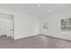Bright and spacious bedroom with two windows and grey flooring at 95 Malauka Place Trak, Ocklawaha, FL 32179
