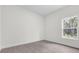 Simple bedroom with wood-look floors and a window at 95 Malauka Place Trak, Ocklawaha, FL 32179