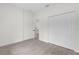 Bright bedroom with double door closet and wood-look floors at 95 Malauka Place Trak, Ocklawaha, FL 32179