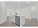 Open concept kitchen with island and stainless steel dishwasher at 95 Malauka Place Trak, Ocklawaha, FL 32179