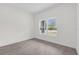 Spacious bedroom with large window and wood-look floors at 95 Malauka Place Trak, Ocklawaha, FL 32179