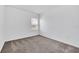 Well-lit bedroom featuring neutral carpeting and a window at 5115 Lake Hamlin Trl, Winter Garden, FL 34787