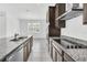 Modern kitchen with granite countertops and stainless steel appliances at 5115 Lake Hamlin Trl, Winter Garden, FL 34787