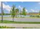 Lakeside at Hamlin community with pond and lush landscaping at 5115 Lake Hamlin Trl, Winter Garden, FL 34787