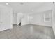 Spacious living room with tile floors and stairs to the second floor at 5115 Lake Hamlin Trl, Winter Garden, FL 34787