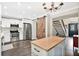 White kitchen with stainless steel appliances and sliding barn door at 603 Antilla Ave, Altamonte Springs, FL 32714