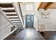 Bright and airy entryway with dark hardwood floors and modern staircase at 603 Antilla Ave, Altamonte Springs, FL 32714