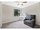 Bright bedroom with plush carpet, comfy chair, and vanity at 603 Antilla Ave, Altamonte Springs, FL 32714