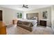 Main bedroom with plush carpeting, large bed and dresser at 603 Antilla Ave, Altamonte Springs, FL 32714