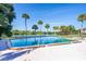 Community pool with palm trees and tennis courts nearby at 630 Cranes Way # 105, Altamonte Springs, FL 32701