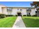 Condo building exterior with walkway and landscaping at 200 Maitland Ave # 174, Altamonte Springs, FL 32701